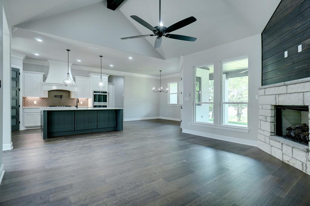 Open concept living area in custom home by Living Stone Construction