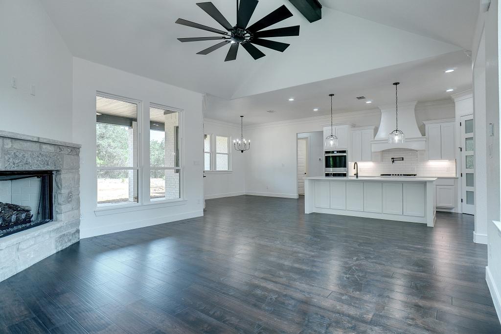 Open concept living area by Living Stone Construction